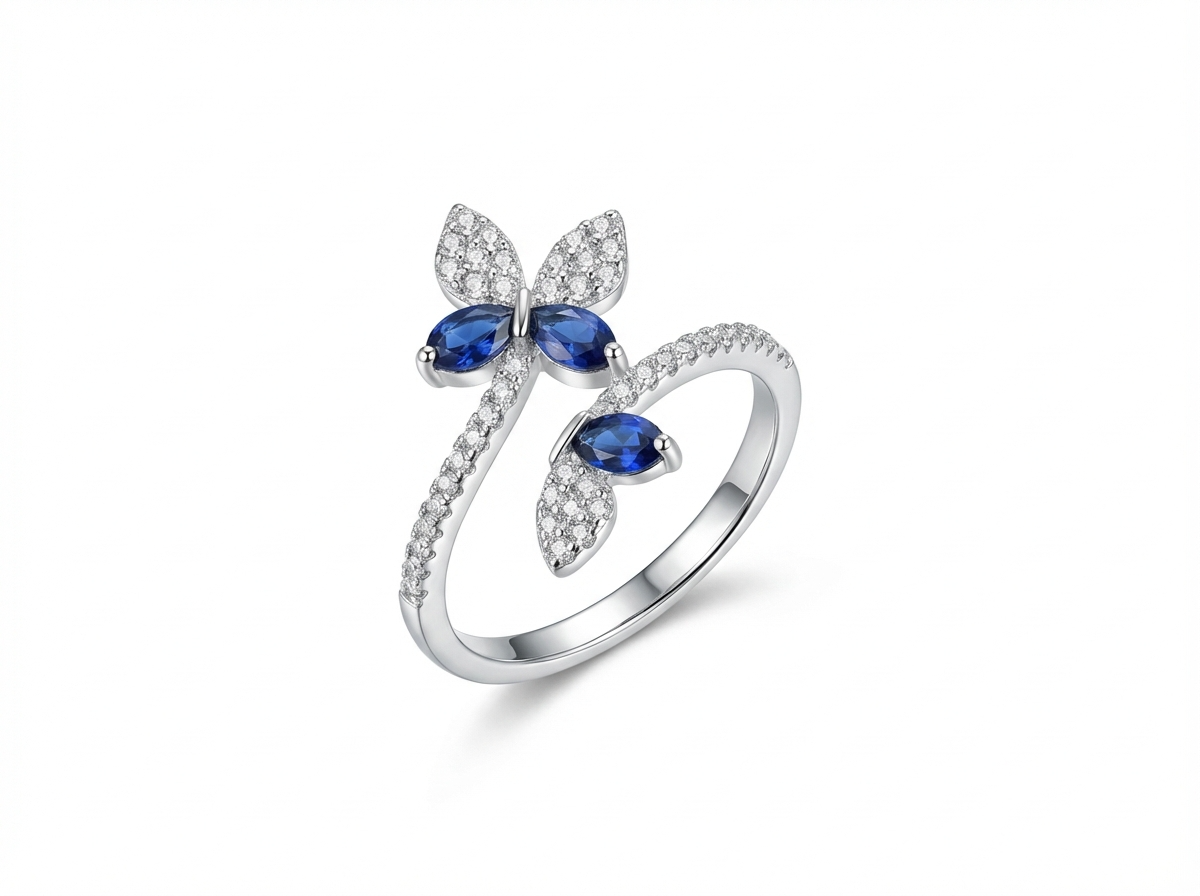 Silver ring with blue gemstones on a white background